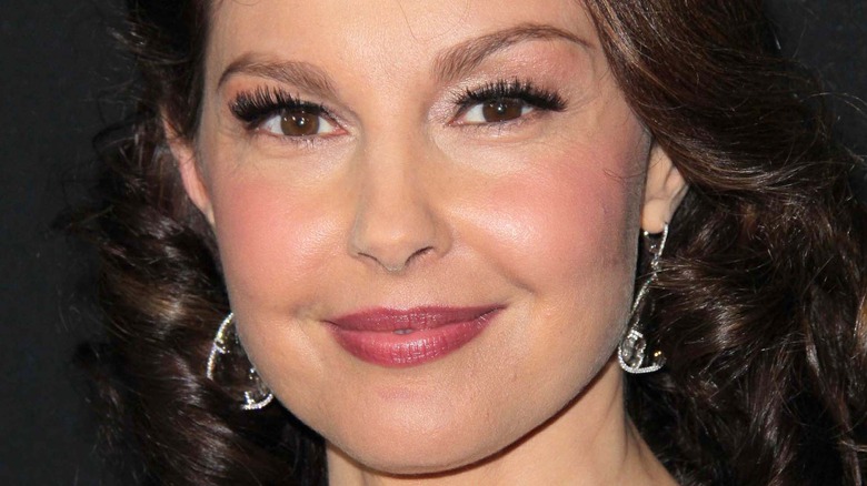 Ashley Judd poses in drop earrings