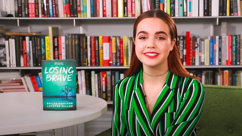 Bailee Madison posing with her book