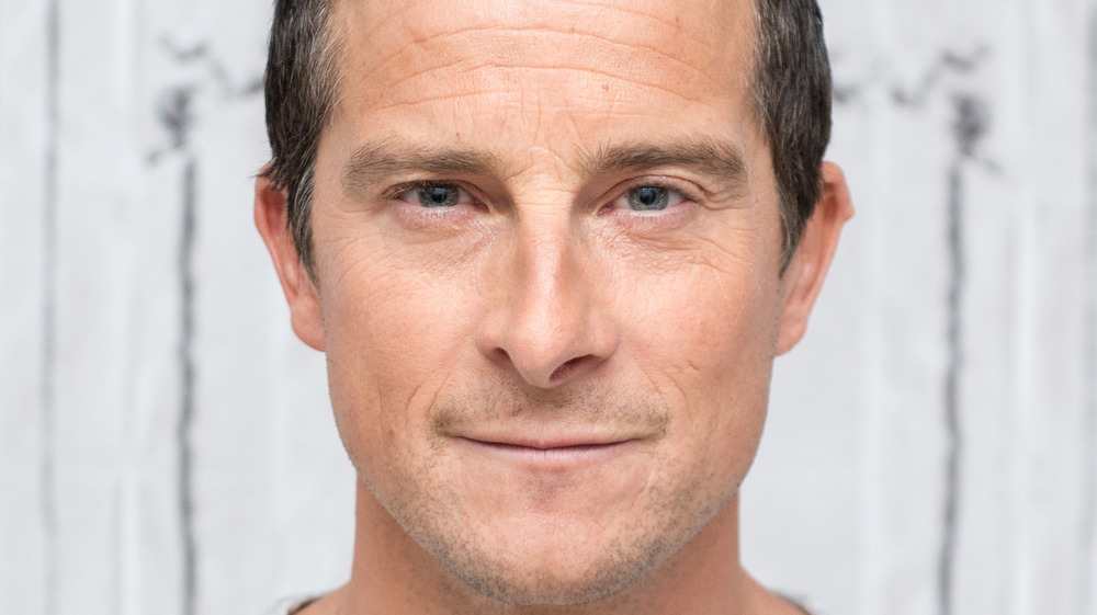 Bear Grylls gives slight smile