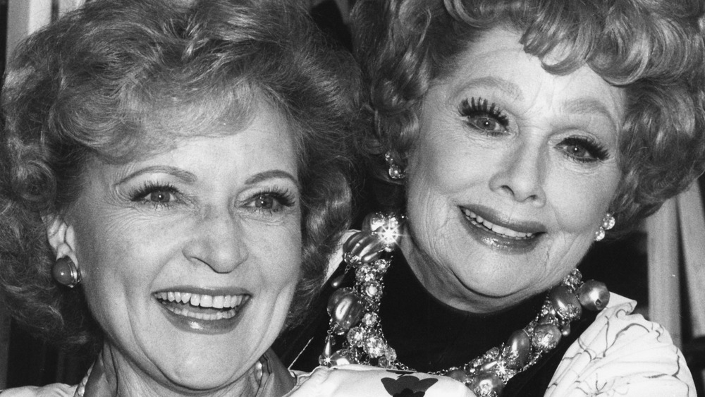 Betty White and Lucille Ball smiling