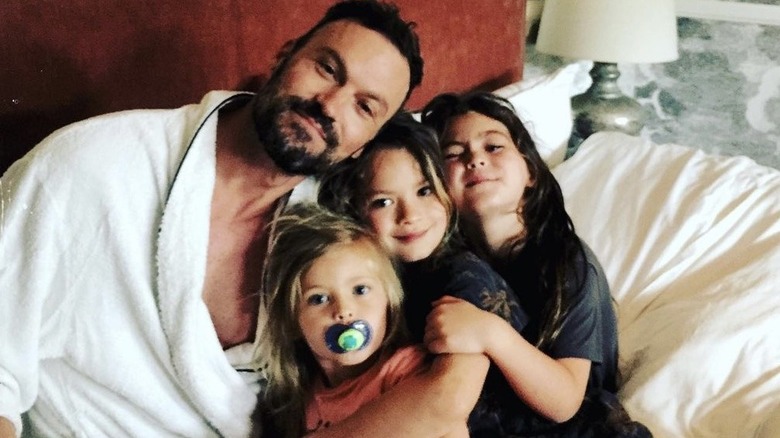 Brian Austin Green snuggling sons