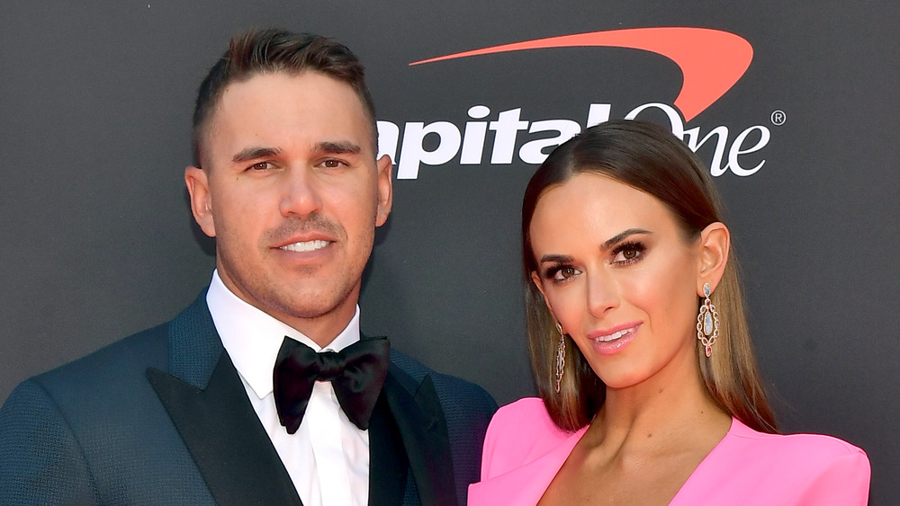 Brooks Koepka and Jena Sims smiling