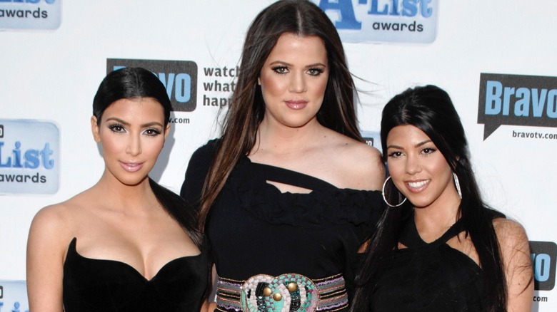 Kim, Khloe, and Kourtney Kardashian smiling