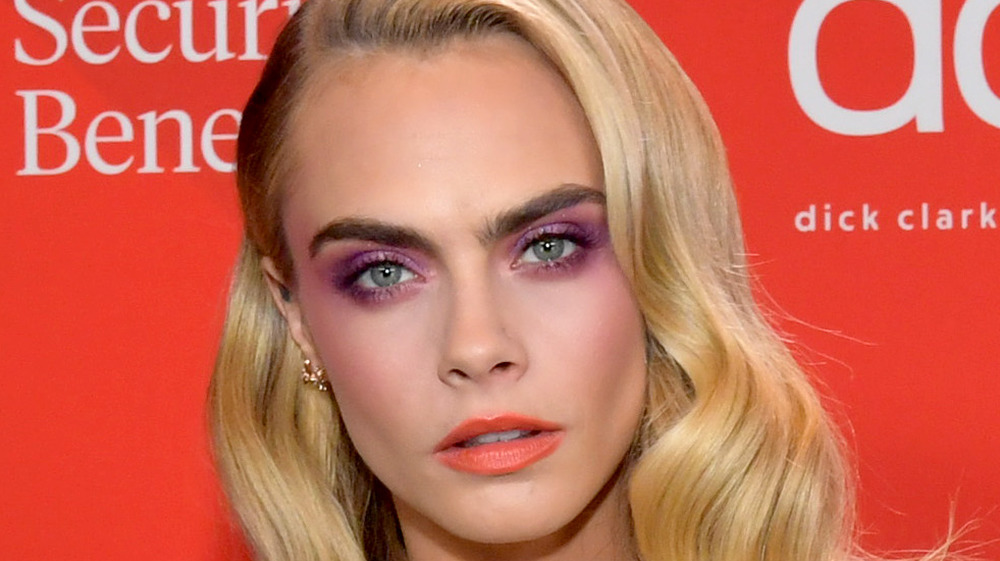 Cara Delevingne wearing violet eyeshadow