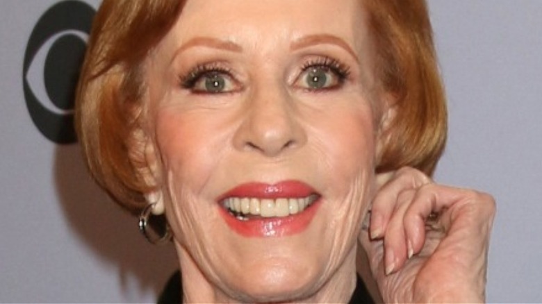 Carol Burnett tugging her ear