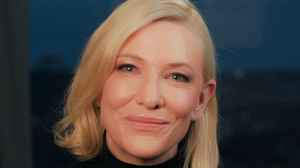 Cate Blanchett smiles while sitting down for an interview