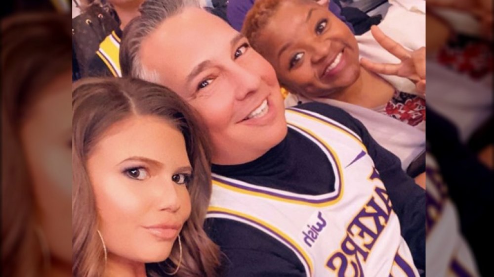 Chanel West Coast taking a selfie with her dad and stepmom