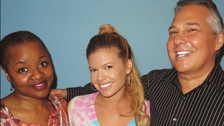 Chanel West Coast smiling with her stepmom and dad
