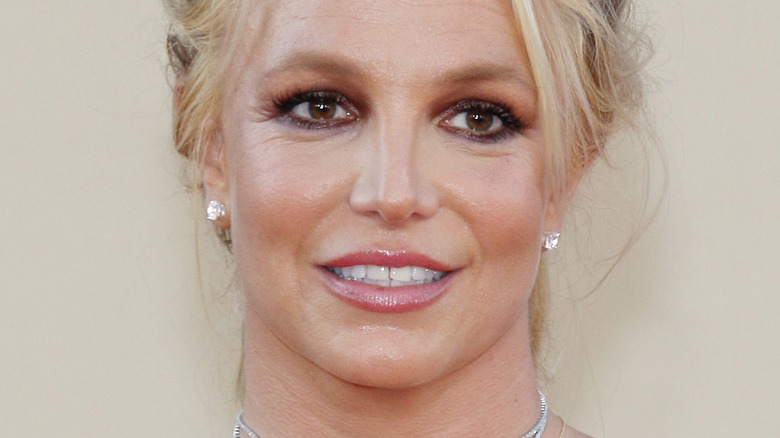Britney Spears smiling and looking to the side