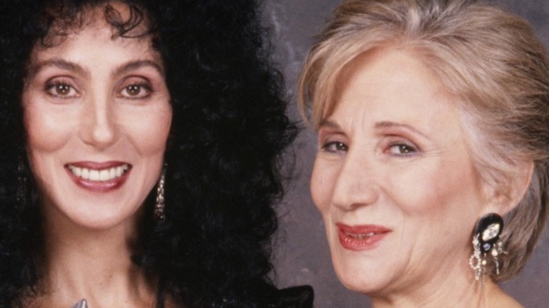  Cher, poses with her People's Choice Award and presenter Olympia Dukakis in 1989 