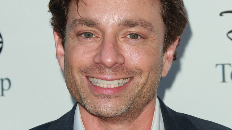 Chris Kattan smiles on red carpet