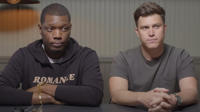 Michael Che and Colin Jost sitting togther