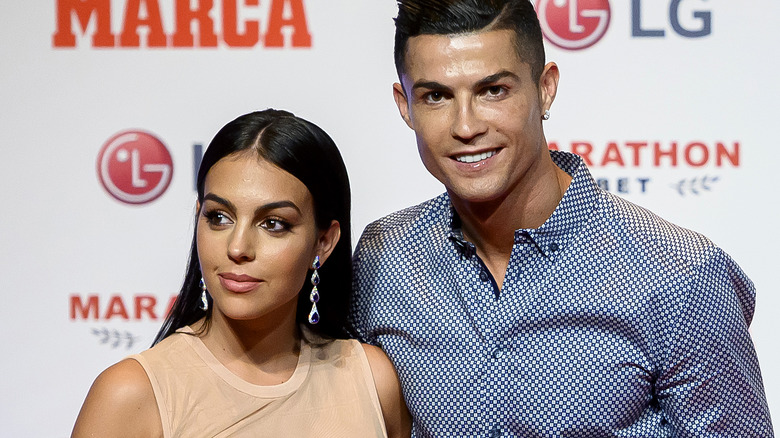 Georgina Rodriguez, Cristiano Ronaldo, smiling