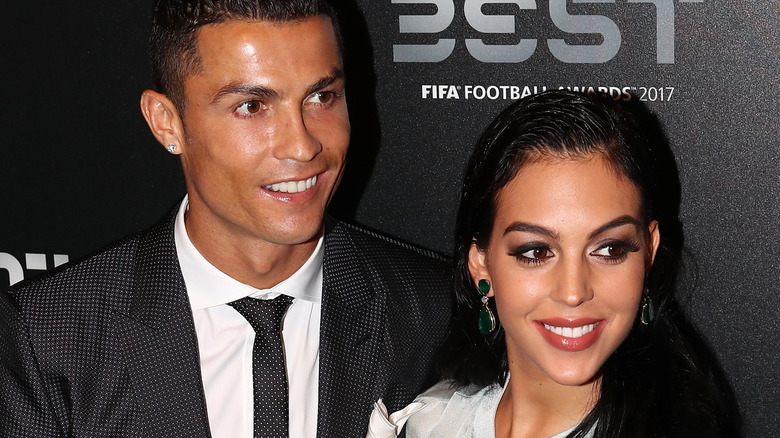Georgina Rodriguez, Cristiano Ronaldo, smiling