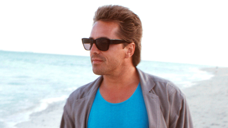 Don Johnson on a beach in 1986