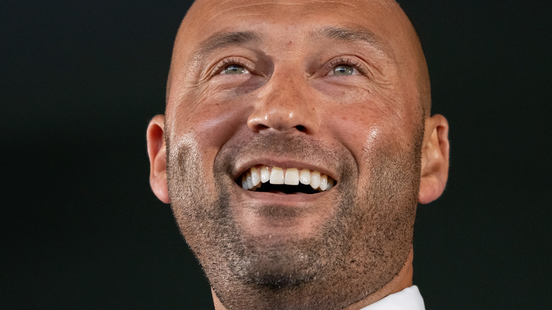 Derek Jeter laughing in suit