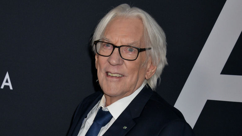Donald Sutherland posing on a red carpet