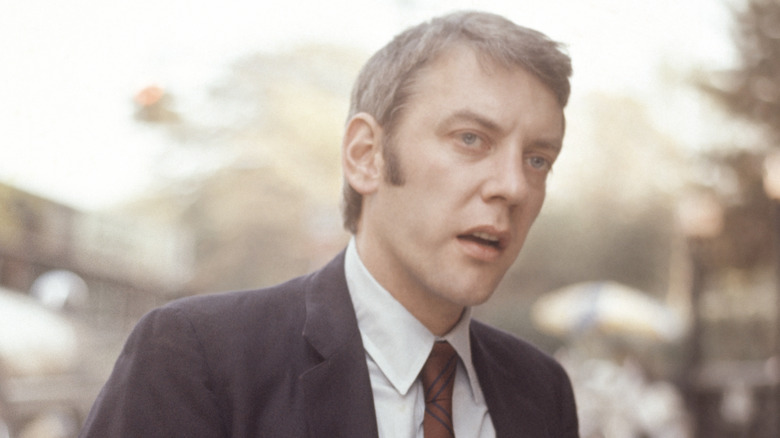 Donald Sutherland standing outdoors