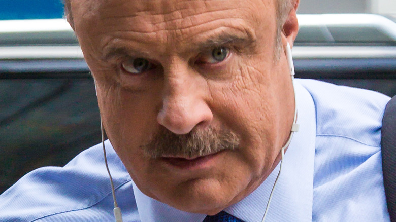 Dr Phil McGraw angry wearing headphones