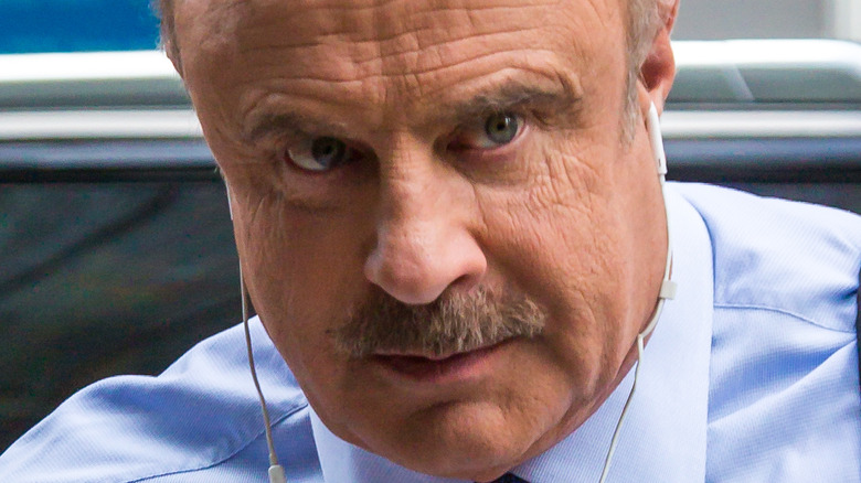 Dr Phil wearing headphones