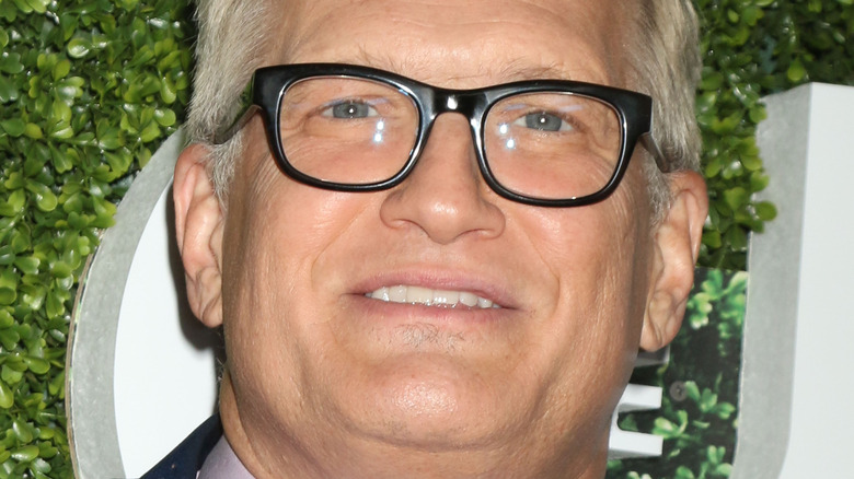 Drew Carey looking up