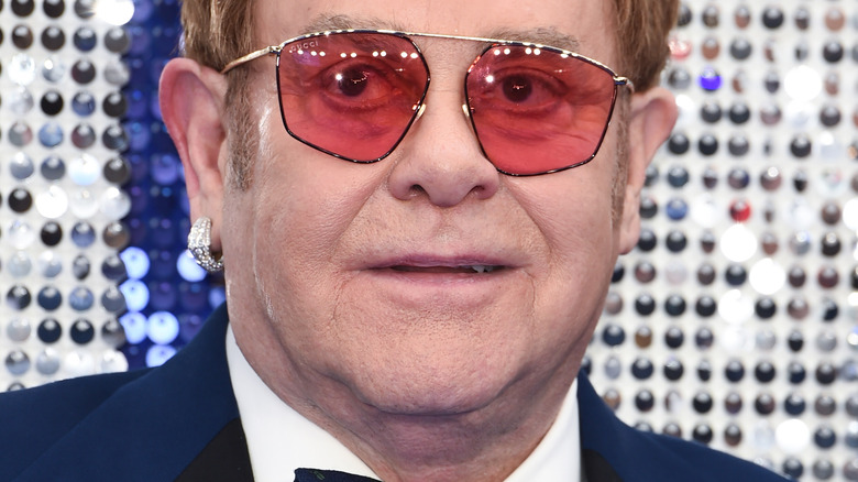 Elton John poses