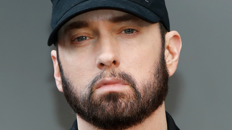 Eminem with a beard in a cap