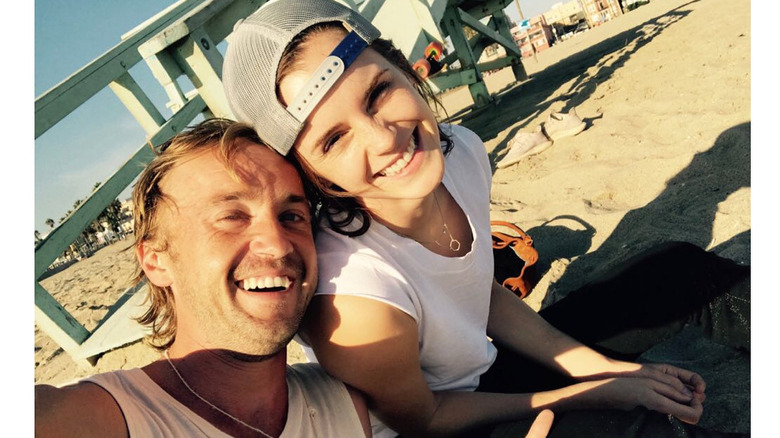 Tom Felton and Emma Watson at the beach