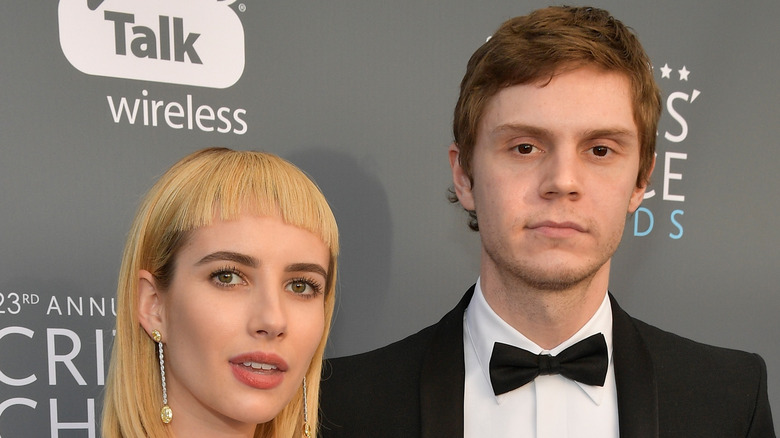 Emma Roberts, Evan Peters, both looking upset