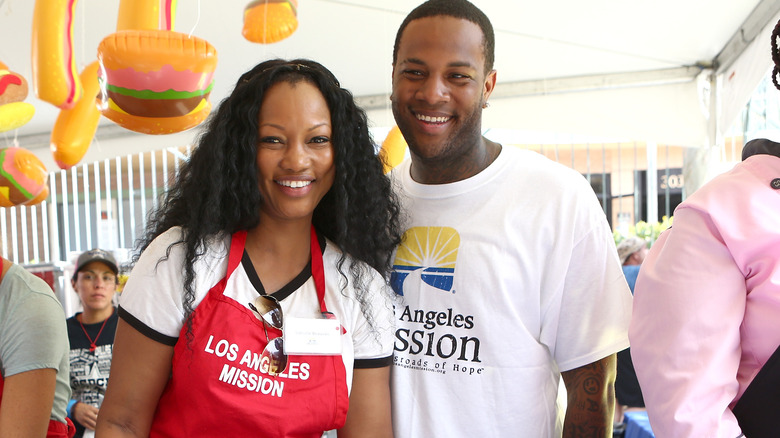 Garcelle Beauvais (L) and son Oliver Saunders at the Los Angeles Mission's End of Summer Arts and Education Fair 