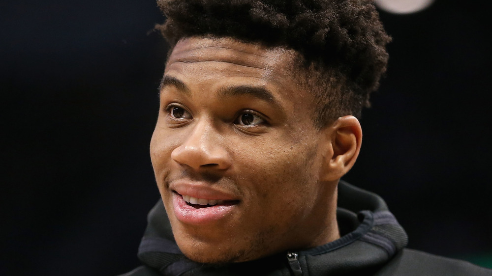 NBA player Giannis Antetokounmpo looking off to the side