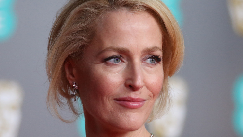 Gillian Anderson with a blonde updo at a premiere