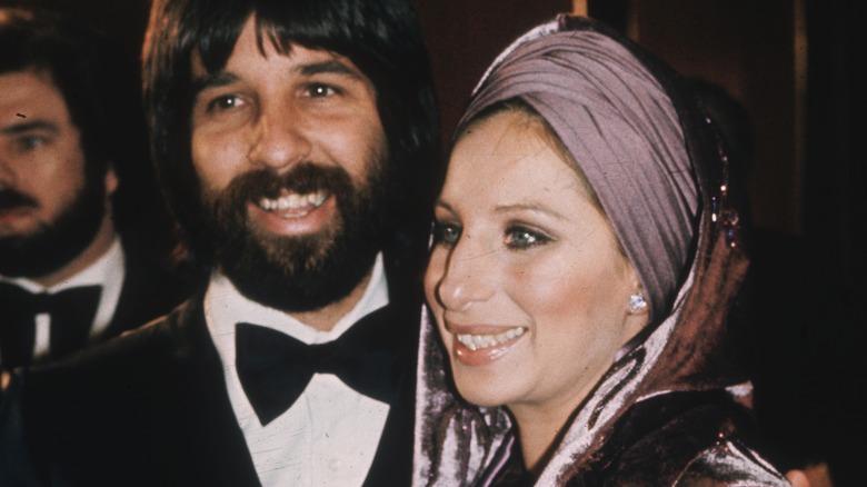 Jon Peters and Barbra Streisand smiling