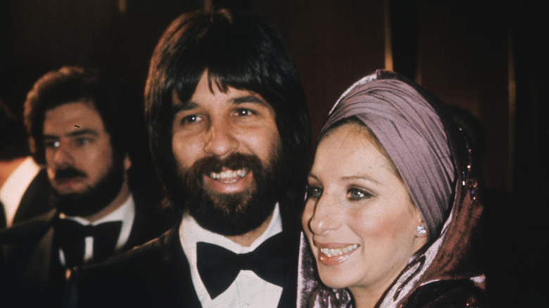 Jon Peters and Barbra Streisand smiling