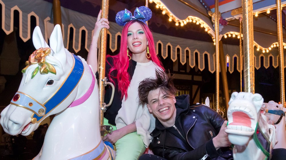 Singer Halsey and musician Yungblud ride on King Arthur Carrousel at Disneyland Park 
