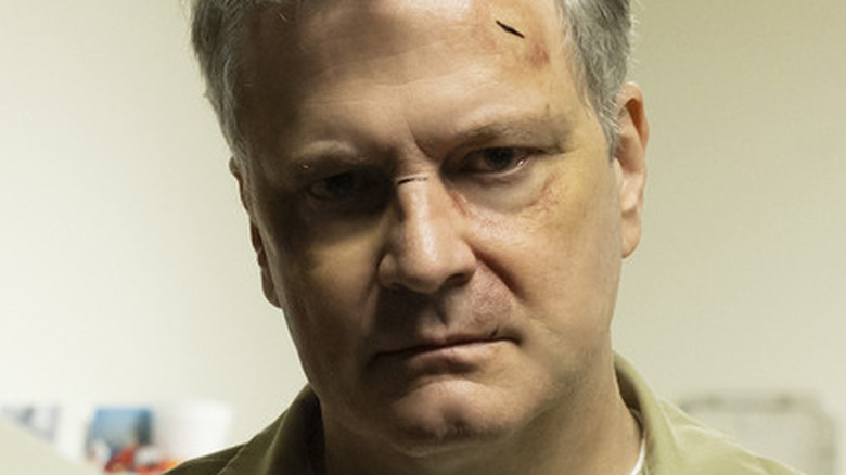 Colin Firth beaten up prison jumpsuit