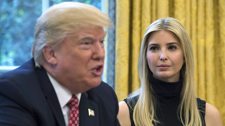 Ivanka Trump watching Donald Trump speak in the Oval Office