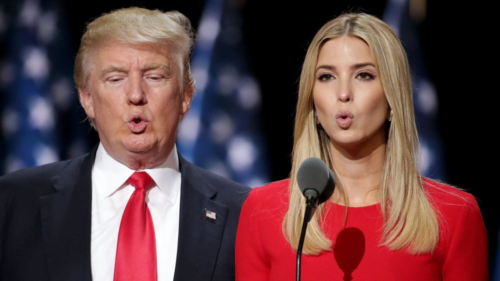 Donald Trump and Ivanka Trump in matching red, testing out the mic at the 2016 RNC