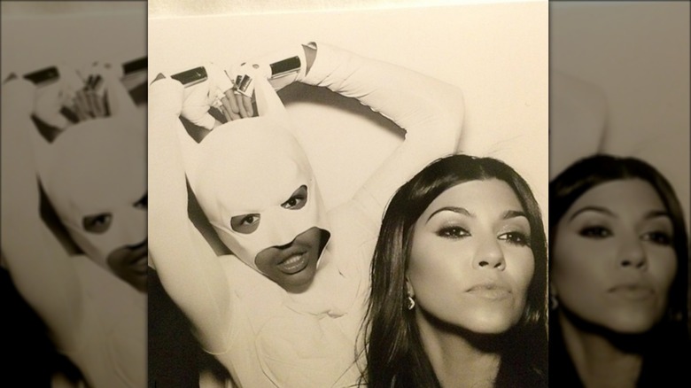 Jaden Smith dressed as Batman, posing with Kourtney Kardashian