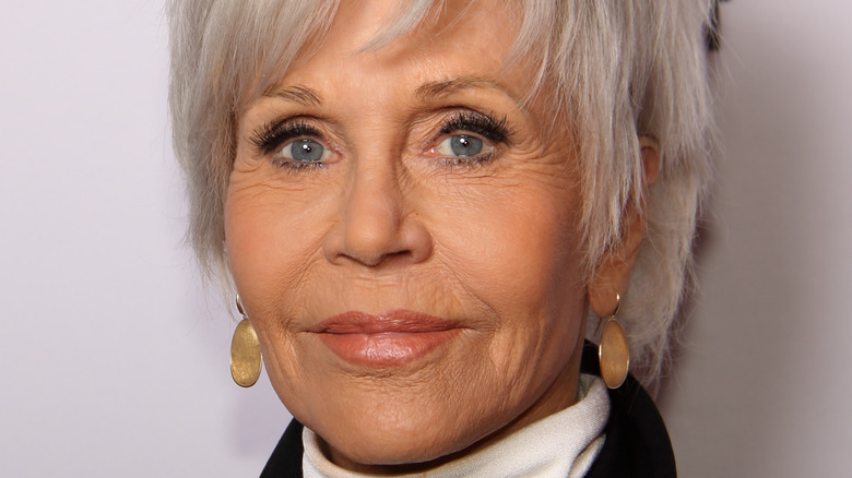 Jane Fonda smiles in short silver hair.