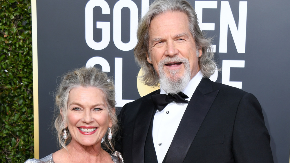 Jeff Bridges and Susan Geston smiling on the red carpet