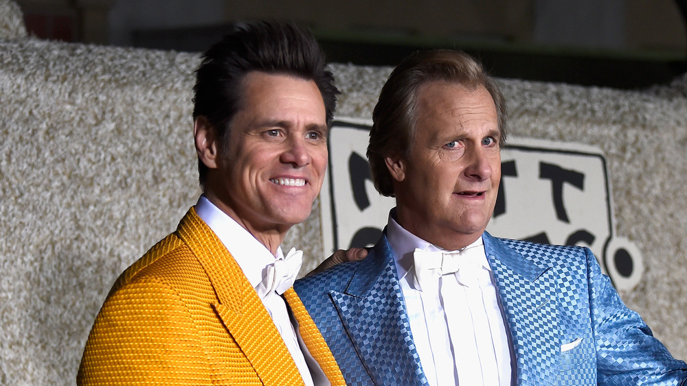 Jim Carrey and Jeff Daniels pose together at the premiere of Dumber and Dumber To