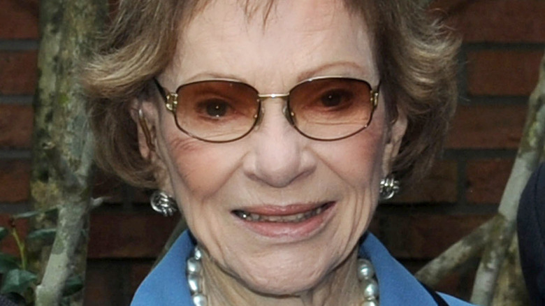 Rosalynn Carter smiling while wearing sunglasses