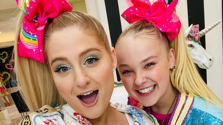Meghan Trainor and Jojo Siwa smiling