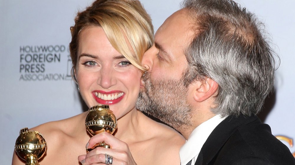 Actress Kate Winslet poses with director Sam Mendes in the press room at the 66th Annual Golden Globe Awards
