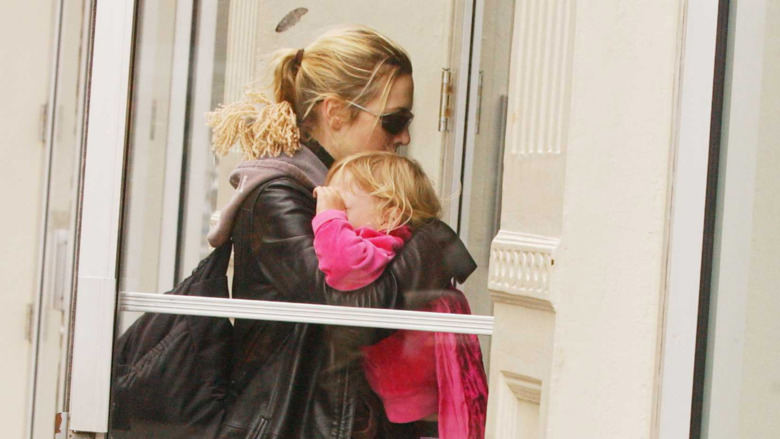 Kate Winslet carrying Mia Threapleton
