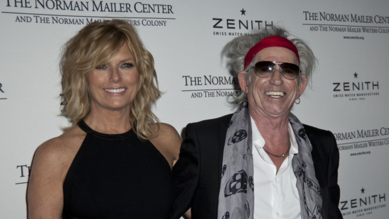Keith Richards and Patti Hansen pose next to each other