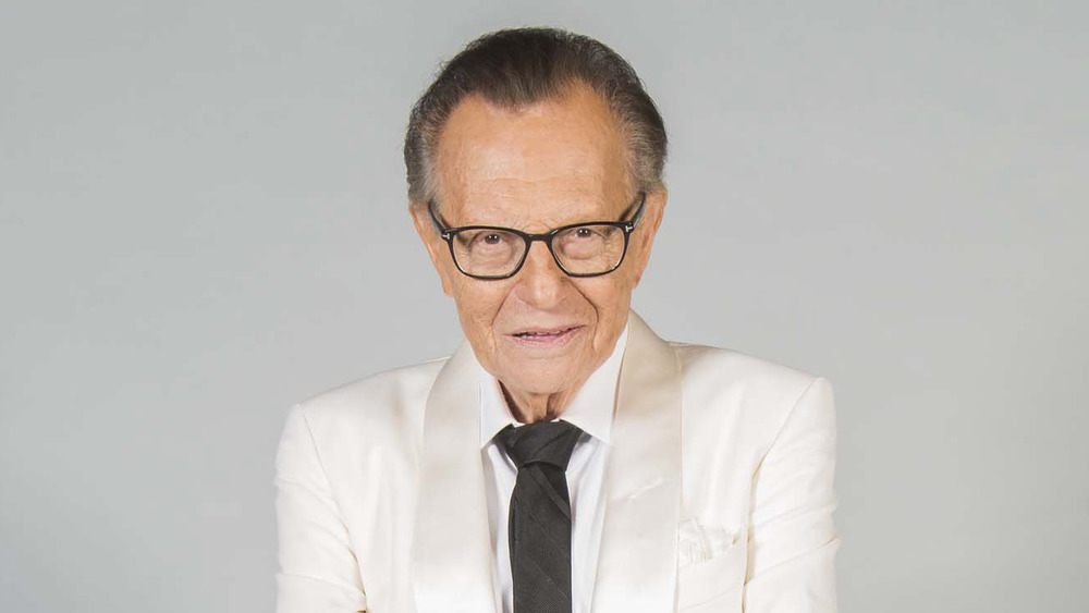 Larry King posing for a portrait