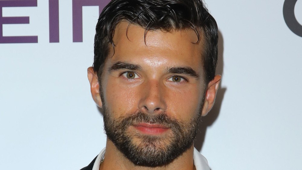 Josh Swickard posing at an event 