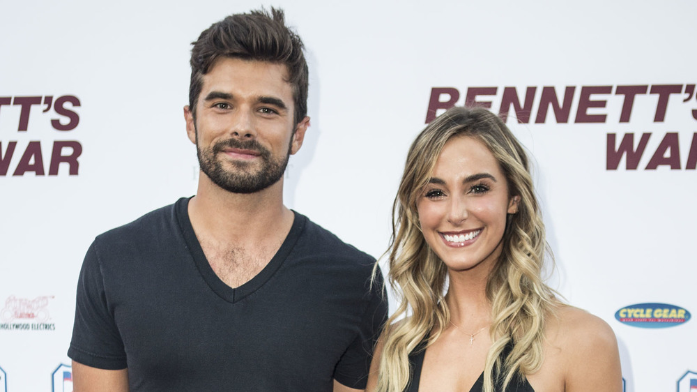 Josh and Lauren Swickard posing at an event 